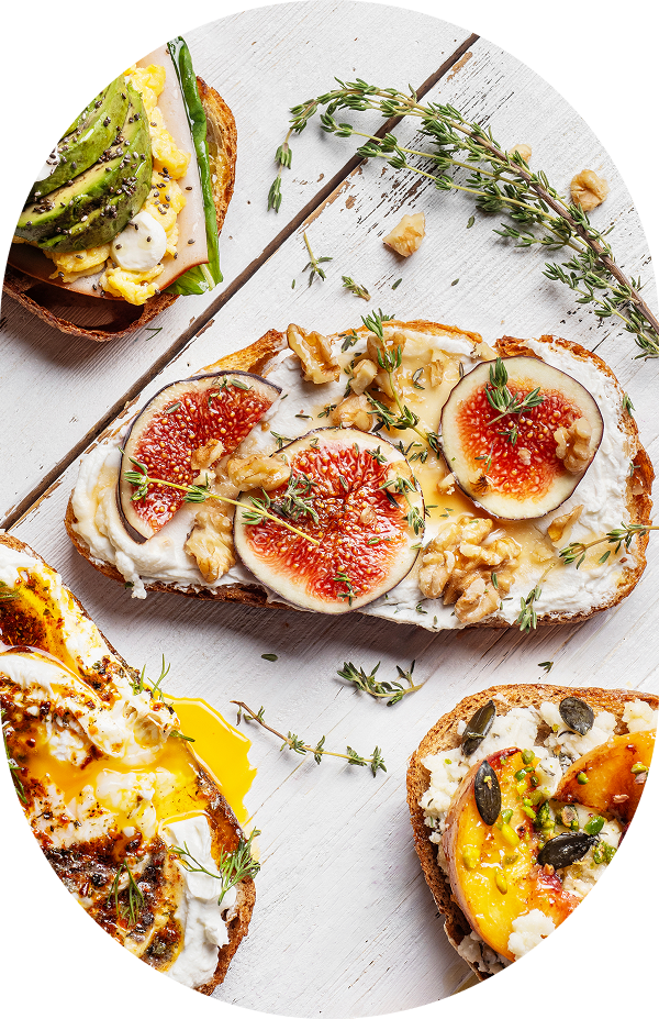 Assorted gourmet toast with fruit and toppings.